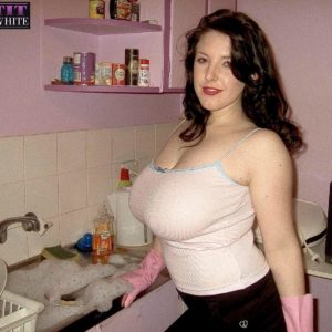 Brown-haired MILF Angela White strutting non naked in mini-skirt and in washroom and kitchen