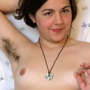 First-timer solo female with furry armpits set her utter thicket free of panties on a bed