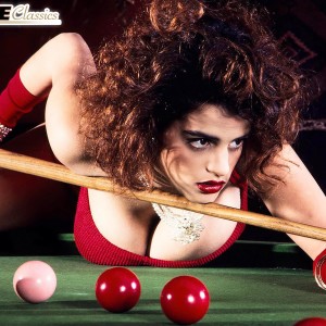 XXX actress Nilli Willis uncovers her immense boobs on pool table in crimson gloves and dress