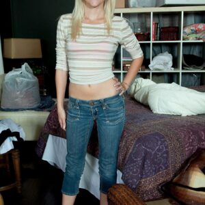 Youthful light-haired amateur discards her denim jeans and pinkish bra and panty set