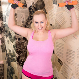 Blonde chick Angel Wicky unleashes her monster-sized all-natural breasts while exercising on a yoga mat