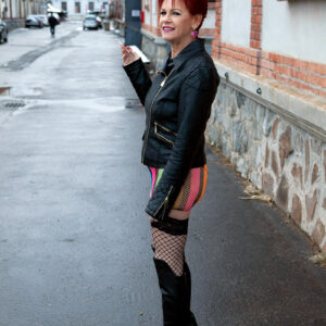 Redheaded 60 plus MILF Caroline Hamsel seduces men on a street in slutty clothing