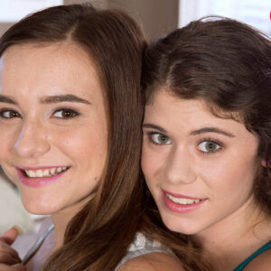Young girls Lexy Lotus and Kharlie Stone share a lezzie kiss during a 3some