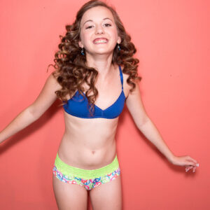 Tiny teen with curly red hair Marissa Mae shows her tiny tits while outfitted in panties