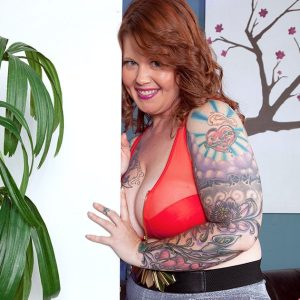 Tattooed fatty with red hair and huge boobs Vanya Vixen fellates a sex toy
