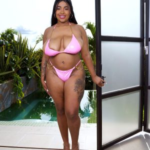 Thick Latina girl Thayana lubricates her knockers after removing swimwear