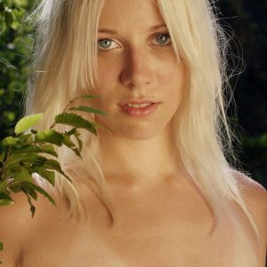 Blonde teen Tasha White wanders around in the outdoors while butt naked