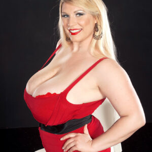 Blonde BBW Renee Ross licks a nipple after loosing her juggs