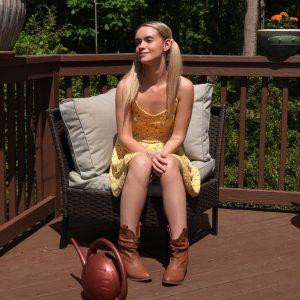 Charming teen Khloe Kingsley urinates on the deck after getting buck naked